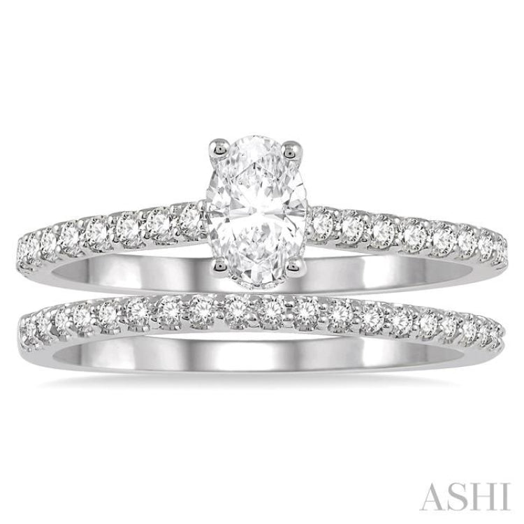 3/4 Ctw Diamond Wedding Set With 5/8 ct Oval Shape Diamond Engagement Ring and 1/6 ct Wedding Band in 14K White Gold