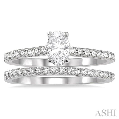 3/4 Ctw Diamond Wedding Set With 5/8 ct Oval Shape Diamond Engagement Ring and 1/6 ct Wedding Band in 14K White Gold