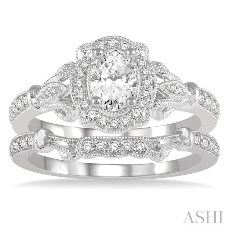 3/4 ctw Round Cut Diamond Wedding Set With 5/8 ctw Oval Cut Engagement Ring and 1/10 ctw Wedding Band in 14K White Gold