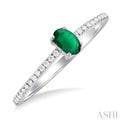 1/10 ctw Petite 5X3MM Oval Cut Emerald and Round Cut Diamond Precious Fashion Ring in 10K White Gold