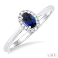 1/20 ctw Round Cut Diamond and 5X3MM Oval Shape Sapphire Halo Precious Ring in 10K White Gold