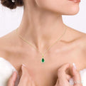 1/20 ctw Round Cut Diamond and 5X3MM Pear Shape Emerald Halo Precious Pendant with Chain in 10K Yellow Gold