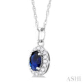 1/20 ctw Round Cut Diamond and 5X3MM Oval Shape Sapphire Halo Precious Pendant with Chain in 10K White Gold