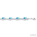 1/10 ctw Oval Cut 7x5MM Blue Topaz and Round Cut Diamond Semi Precious Bracelet in Sterling Silver