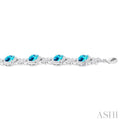 1/10 ctw Cushion Cut 7X7 MM Blue Topaz and Round Cut Diamond Semi Precious Bracelet in Sterling Silver