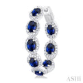 3/4 ctw Interior & Exterior 4X3 MM Oval Cut Sapphire and Round Cut Diamond Halo Precious Hoop Earring in 14K White Gold